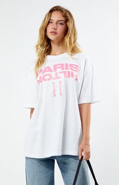 PacSun exclusive! Step up your graphic tee rotation with the Paris Hilton Pillars Oversized T-Shirt. Featuring short sleeves with dropped shoulders and an oversized fit, this tee delivers all-day comfort with a laidback vibe. Complete with Paris Hilton graphics on the front and back, it's the perfect piece to add some iconic flair to your wardrobe.Solid color teeCrew necklineShort sleevesDropped shouldersParis Hilton graphicsOversized fit100% cottonMachine washableModel is wearing a size smallFemale Model measurements: 5’9” height, 32” bust, 23” waist, 34.5” hipsMale Model Measurements: 6'2 Height, 30" Waist, 32" Inseam PacSun Womens Paris Hilton Pillars Oversized T-Shirt - White size Small Summer Screen Print Drop Shoulder Tops, Summer Drop Shoulder Top With Screen Print, Spring Oversized Tops With Logo Print, Oversized Logo Print Tops For Summer, White Drop Shoulder T-shirt For Spring, Sporty Boxy Fit T-shirt For Summer, Trendy Drop Shoulder Summer T-shirt, Oversized Trendy T-shirt With Logo Print, Trendy Oversized T-shirt With Logo Print