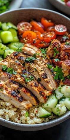 a bowl filled with meat and vegetables on top of a table