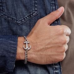 "Looking for a gift for your man? You've found the perfect item for this!  Introducing our stylish stainless steel anchor bracelet for men, the perfect accessory for any modern gentleman. Handcrafted with precision and attention to detail, this bracelet offers both durability and sophistication. The stainless steel construction ensures it is resistant to everyday wear and tear, while the anchor charm adds a nautical touch. Whether you're hitting the beach or headed to a formal event, this bracel Silver Nautical Bracelets As A Gift, Stainless Steel Chain Bracelet For Everyday And Father's Day, Stainless Steel Everyday Chain Bracelet For Father's Day, Masculine Stainless Steel Jewelry For Gifts, Masculine Stainless Steel Jewelry For Gift, Masculine Stainless Steel Jewelry As Gift, Masculine Silver Bracelets With Stainless Steel Clasp, Silver Anchor Bracelet Gift, Silver Stainless Steel Bracelets For Father's Day