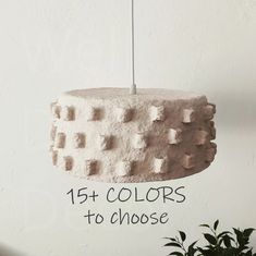 a cake hanging from a ceiling with the words, 15 colors to choose on it