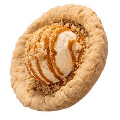 a cookie with ice cream and caramel on top