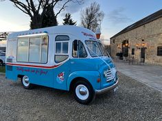 an ice cream truck parked in front of a building