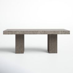 a concrete bench sitting on top of a white floor