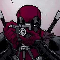 a deadpool character holding a camera in front of his face