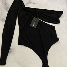 Brand New Still With Tags Black Stretch Bodysuit For Party, Elegant Black One-piece Bodysuit, Black Long Sleeve Bodysuit For Going Out, Trendy Black Bodysuit For Club, Trendy Black Club Bodysuit, Black Fitted Trendy Bodysuit, Black Stretch Bodysuit For Going Out, Fitted Black Trendy Bodysuit, Black Fitted Bodysuit For Night Out