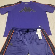 A Sporty Pair Of Kappa Active Shorts Features A Drawstring Waistband And Woven Silhouette. The Shirt Is Fitted Through The Chest, Armholes And Sides Shorts Elastic Waist With Drawstring Side Slash Pockets 100% Polyester Machine Wash Imported 29" Length (Size L) Shirt: Crewneck Short Sleeves Excellent Shirt And Shorts Combination That Will Turn Heads At Any Function. Blue Sporty Crew Neck Set, Blue Sets For Summer Streetwear, Blue Summer Streetwear Sets, Casual Blue Sets For Streetwear, Blue Sporty Sets For Streetwear, Blue Sporty Streetwear Sets, Blue Sporty Short Sleeve Sets, Blue Short Sleeve Sporty Sets, Big Tshirt