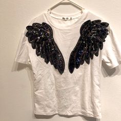 White Sequin Angel Wings T-Shirt -Two Sequin Angel Wings Angel Wings Jacket, White Dress With Angel Wings, Angel Wings Shirt Design, Angel Tshirt, Lion King Shirt, Angel T Shirt, Tie Front Cardigan, Yellow Shorts, Gray Tshirt