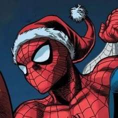 a spider - man with a santa hat on