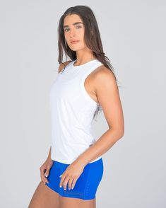 Designed in the same breathable fabric as our best-selling Laser Cut Pullover, this full-length tank is tailored to flatter with a body-slimming fit. It features intricate laser cut details throughout, enhancing ventilation to keep you cool and comfortable during intense workouts. Ideal for those who prefer extra coverage, this tank ensures you feel secure and stylish whether you're powering through a cardio session or mastering yoga poses. It's the perfect choice for active women seeking a blen Athleisure Fitted Tank Top With Light Support, Fitted Light Support Tank Top For Athleisure, White Compression Top With Built-in Bra, Breathable Fitted Racerback Tank Top, Fitted Breathable Racerback Tank Top, Fitted Activewear With Mesh Back For Spring, Spring Fitted Activewear With Mesh Back, White Compressive Racerback Tank Top, White Stretch Top With Mesh Back