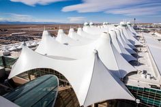 an aerial view of the airport with many large white tents on it's sides