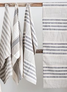 four towels hanging on a towel rack