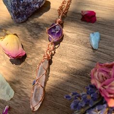 "☾ Double Amethyst + Quartz Necklace ☾ High quality, small gemmy Amethyst in its raw form, above a raw clear quartz point, in a secure & subtle setting that highlights the stones These pendants come in pure copper or sterling silver. Choose from an adjustable Faux leather chord (vegan friendly) a matching 18\" copper chain or a matching 18\" sterling silver chain. Faux leather chords are \"vegan friendly\" because they are actually cotton made to look like leather. These chords are also tied Spiritual Crystal Necklaces With Gemstone For Her, Spiritual Crystal Gemstone Necklaces As Gift For Her, Spiritual Gemstone Crystal Necklace For Her, Spiritual Crystal Necklace With Gemstone For Her, Amethyst Crystal Healing Necklace With Round Pendant, Amethyst Amulet Jewelry For Gifts, Amethyst Amulet Jewelry As Gift, Purple Amulet Jewelry As A Gift, Purple Amulet Jewelry As Gift