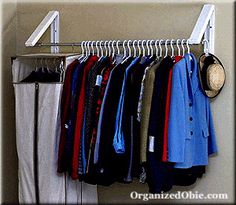 a rack with clothes and hats hanging on it