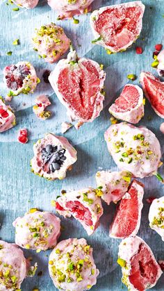 several pieces of fruit are shown on a blue surface with confetti sprinkled around them