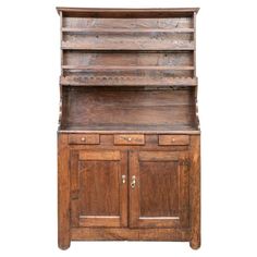 an old wooden hutch with drawers and cupboards on the bottom shelf, isolated against a white background