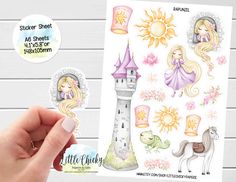 a hand holding up a sticker sheet with princess and unicorns on it