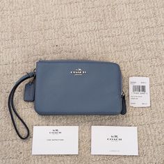 Nwt Coach Light Blue / Gray Wristlet. Silver Colored Hardware. The Tag Says The Color Is Dusk. No Original Packaging Included. Coach Leather Wristlet With Zipper Closure, Coach Blue Wristlet For Travel, Everyday Blue Pouch Wristlet, Coach Blue Clutch For Everyday Use, Blue Coach Clutch For Everyday Use, Blue Leather Coach Wallet, Blue Travel Wristlet With Removable Pouch, Everyday Coach Leather Wristlet, Blue Wristlet With Removable Pouch For Travel