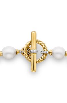 Cultured South Sea pearls bring lustrous shine to this link bracelet crafted of 18-karat gold with sparkling round-cut diamonds highlighting the toggle clasp. Total diamond weight: 0.59ct. Pearl size: 10–12mm 18k-gold/cultured pearl/diamond Made in Italy Classic Gold Diamond Pearl Bracelet, Classic Gold Pearl Bracelet With Diamonds, Elegant Yellow Gold Diamond Pearl Bracelet, Luxury Pearl Bracelet With Diamond Accents, Luxury Gold Bracelet With Round Beads For Formal Occasions, Elegant Rondelle Gold Bracelet For Formal Occasions, Luxury Yellow Gold Diamond Pearl Bracelet, Luxury Diamond Pearl Bracelet In Yellow Gold, Elegant Gold Bracelet With Spring Ring Clasp