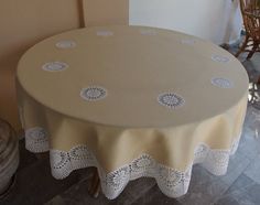 a round table with white doily on it