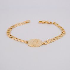 Gift of faith and prayer for women devoted to Our Lady of Guadalupe Meaningful and classic design Genuine Mexican gold-filled jewelry and outstanding craftsmanship Gold-filled jewelry is hypoallergenic, doesn't tarnish easily, and lasts longer than gold-plated. Everyday trendy jewelry piece A great gift for women of any age This beautiful Gold Guadalupe Chain Bracelet is a gift of faith and prayer for women devoted to Our Lady of Guadalupe. The meaningful and classic design is made with genuine Gold Hypoallergenic Name Bracelet, Gold Plated Jewelry With Miraculous Medal, Gold-plated Jewelry With Miraculous Medal, Gold Spiritual Charm Bracelet, Gold Spiritual Charm Bracelet With Lobster Clasp, Gold Bracelet With Figaro Chain, Gold Chain Bracelet With Adjustable Chain For Spiritual Wear, Gold Hypoallergenic Rosary Bracelet, Spiritual Gold Charm Bracelet Hypoallergenic