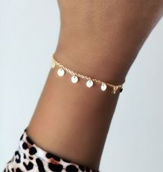 Gold-plated silver mini-chain bracelet, for a modern and elegant look, with 8 mini charms in the form of discs or small plates.  This bracelet will bring a subtle movement to your wrist thanks to its 8 dangling plates. Each round and flat badge measures 4 mm in diameter.  The total length of the bracelet is 16 cm and it has an additional 3 cm as an extension, so that you can adjust it to the perfect size of your wrist.  Ideal both to wear it alone and to combine with other bracelets in your jewelry box. --------------------- COMBINE: Buy more items no extra charge for each order, you just pay one shipping fee no matter how many items you purchase. --------------------- SHIPPING METHOD: It will take approx 1 week to US & Canada, and 3-4 days to Europe.   All orders would be shipped within 1 Dainty Metal Charm Bracelet For Party, Dainty Metal Chain Bracelet For Parties, Gold Nickel-free Bracelets For Party, Rose Gold Bracelets With Delicate Chain, Dainty Round Chain Bracelet For Party, Dainty Metal Bracelets For Party, Minimalist Bangle Chain Bracelet For Parties, Dainty Metal Beaded Bracelets For Party, Dainty Round Metal Chain Bracelet