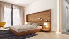 a bedroom with a large bed and wooden headboard