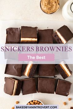 some brownies with peanut butter on top and the words, snickkers brownies the best