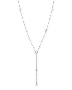 Diamond stations set in 14K white gold stud this lariat necklace. Diamond Lariat Backdrop Necklace In Fine Jewelry Style, Fine Jewelry Diamond Lariat Backdrop Necklace, Fine Jewelry Lariat With Cubic Zirconia, Cubic Zirconia Lariat Fine Jewelry, Fine Jewelry Cubic Zirconia Lariat, Classic Round Diamond Lariat Necklace, White Gold Diamond Cut Lariat Necklace, White Gold Lariat Necklace With Diamond Cut, White Gold Sterling Silver Lariat Jewelry