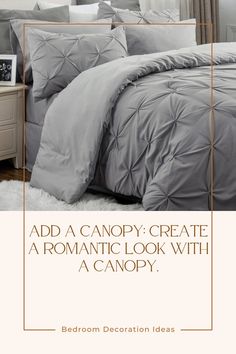 a bed with grey comforter and pillows