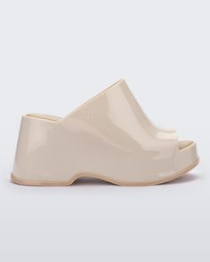 Side view of a Beige Melissa Patty platform mule.