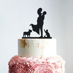 a wedding cake topper that says mr and mrs with dog silhouettes on it