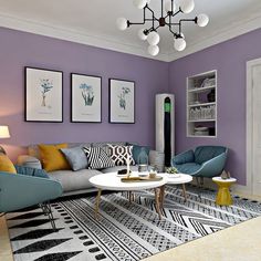 a living room filled with furniture and paintings on the wall next to a coffee table