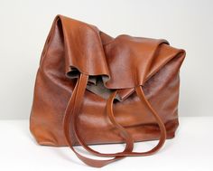 "Very Large Women Bag, Large weekender bag, Brown Leather Tote Bag, Cognac Brown Oversized tote bag. Dimension details: Max width at the top: 51 cm /20\" Height: 53 cm /21\" Depth:11,5 cm / 4,5\" Handle drop: 25,5 cm / 10\" Very large, high bag made of soft cowhide. The oversize tall bag has a simple design and practical character that will make it very practical in many situations. Bag without lining with two large pockets. Add this gorgeous bag to your collection!! To return to my shop, simply Black School Bags, Extra Large Tote Bags, Essential Oil Bag, Brown Leather Tote Bag, Women Backpack Travel, Oil Bag, Large Leather Bag, Everyday Handbag, Oversized Tote Bag