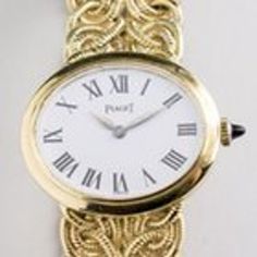 18k yellow gold watch, white dial with Roman numerals, signed Piaget, with a fancy gold bracelet signed Piaget and with a P on the clasp and marked 750.  Length 6 inches, 46.8 grams. 17 Jewel. Piaget movement #764743 Case # 6801K40, 248780 Fancy Gold Bracelet, Gold Armband, Women Wrist Watch, Women's Watch, White Dial, Roman Numerals, Wrist Watches, Gold Watch, 6 Inches