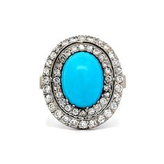 an oval turquoise and diamond ring