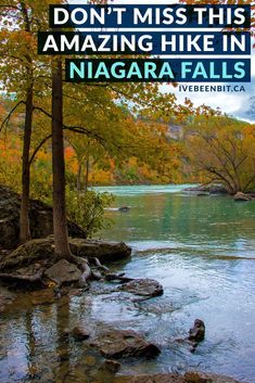 a river surrounded by trees with the words don't miss this amazing hike in niagara falls