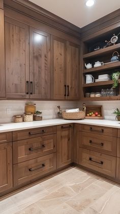 a kitchen with wooden cabinets and white counter tops