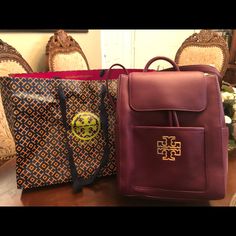 Gorgeous Brand New Tory Burch Britten Backpack Color: Red Agat Luxury Red Backpack For Travel, Burgundy Standard Backpack For Travel, Luxury Red Backpack For Daily Use, Burgundy Travel Backpack, Luxury Red Backpack Bags, Luxury Red Backpack, Luxury Red Leather Standard Backpack, Luxury Red Leather Backpack, Red Backpack With Removable Pouch