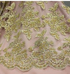 This beautiful Beaded & Corded lace fabric is perfect for weddings, quinceanera dresses, evening gowns, and more. The fabric is 100% polyester and is embroidered with elegant beads, pearls, and sequins to make a truly unique masterpiece. This handcrafted Beaded & Corded lace fabric is perfect for any special occasion, offering an unrivaled elegance that will look perfect for any bridal or couture gowns. The beaded and corded lace fabric is available in 4 beautiful colors, making it the perfect p Fitted Dresses With Intricate Embroidery For Quinceanera, Quinceanera Gown With Intricate Embroidery, Gold Embellished Dress For Quinceanera, Elegant Embroidered Quinceanera Gown, Embroidered Gown For Wedding And Prom Season, Floor-length Gown With Intricate Embroidery For Quinceanera, Fitted Gold Gown For Quinceanera, Embroidered Gown For Wedding During Prom Season, Gold Fitted Quinceanera Dress For Prom Season