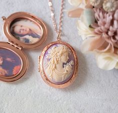 This is a vintage inspired oval locket necklace in beautiful rose gold finish. The oval locket is has lovely lace scalloped details. The center focal cameo is a highly detailed ivory cream lady face profile on a beautiful lavender colored background. The locket is suspended from a rose gold plated brass chain with lobster clasp closure. Measurement: Locket: approx. 1.9'' x 1.4'' (48mm x 35mm) Cameo: 40mm x 30mm PERSONALISATION We can personalize this locket by adding 1 or 2 photos for you. You c Vintage Rose Gold Oval Locket Necklace, Oval Cameo Necklace Keepsake, Oval Cameo Necklace For Keepsake, Oval Rose Gold Keepsake Necklace, Oval Locket Necklace, Lady Face, Face Profile, Oval Locket, Gold Locket