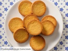 a white plate topped with cookies on top of a blue and white table cloth