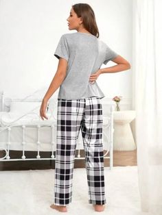 Discover ultimate comfort with our Graphic Tee And Plaid Print Pants Pajama Set. Embrace style effortlessly with plaid and slogan patterns. Designed for relaxation, this pant set offers a loose-fit pajama and short-sleeved tee. Crafted from a fabric with a slight stretch, it ensures unrestricted movement. Enrich your loungewear collection with this blend of style and ease. Features: Pattern Type: Plaid, Slogan Type: Pant Sets Neckline: Round Neck Sleeve Length: Short Sleeve Fit Type: Loose Shee Plaid Cotton Sleepwear Sets, Plaid Cotton Sleep Sets, Cotton Plaid Sleepwear For Loungewear, Plaid Cotton Sleepwear For Loungewear, Comfortable Plaid Sleepwear For Loungewear, Plaid Casual Sleepwear For Lounging, Casual Plaid Sleepwear For Lounging, Plaid Relaxed Fit Sleepwear For Loungewear, Plaid Cotton Loungewear Sets