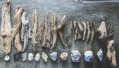 various types of rocks and wood on a table