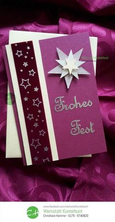 two greeting cards with stars on them, one is purple and the other is white