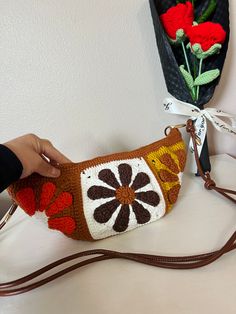 Hand-crocheted dumpling crossbody bag with adjustable faux leather straps, free shipping on orders over $35. Crochet Dumpling Bag, Trendy Brown Crochet Bag With Adjustable Strap, Trendy Brown Crochet Pouch Bag, Casual Brown Crochet Crossbody Bag, Brown Crochet Hobo Bag For Everyday Use, Brown Hobo Crochet Bag For Everyday, Brown Crochet Crossbody Bag For Daily Use, Brown Crossbody Crochet Bag For Daily Use, Trendy Crochet Crossbody Shoulder Bag