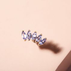 Tanzanite Tiara Stud – STONE AND STRAND Stone And Strand, Colored Gemstones, Expensive Taste, Single Earring, Just Giving, Up To Date, Gemstone Colors, Tiara, Heart Ring