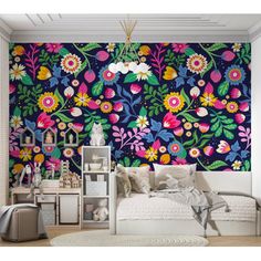 a bedroom with colorful flowers on the wall