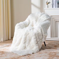 a white chair sitting on top of a shaggy rug