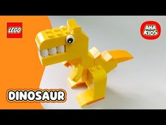 a yellow lego dinosaur with its mouth open