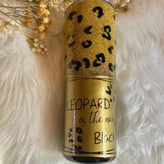 leopard print is the new black on this gold glittered wine bottle that says leopard is the new black